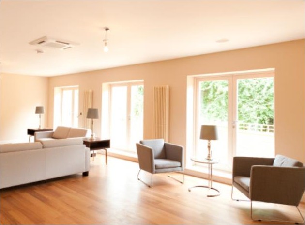 Living room opening towards the garden — project photograph.