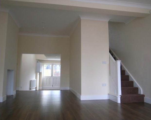 Refurbished living space and staircase — project photograph.