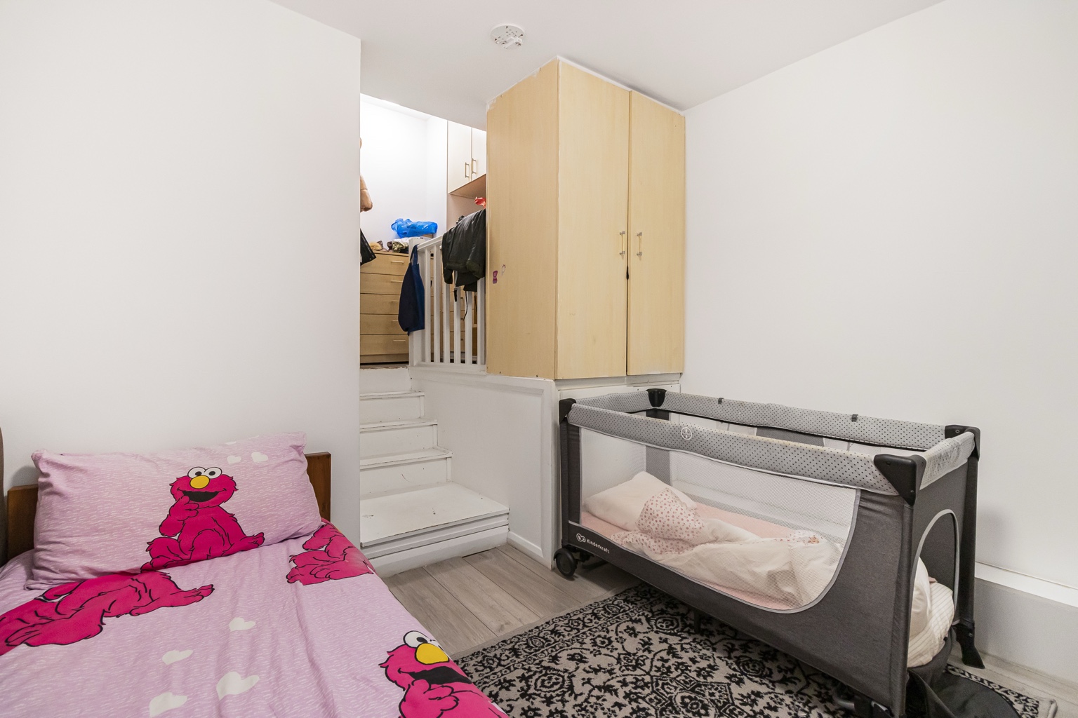Bedroom with internal steps in the West Green Road flat. Furniture not included.