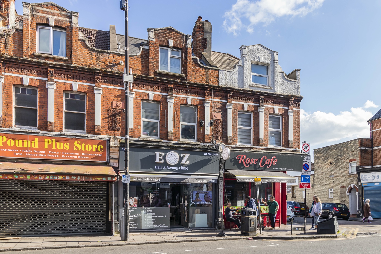 Exterior of a building on West Green Road, showing flats above commercial premises.